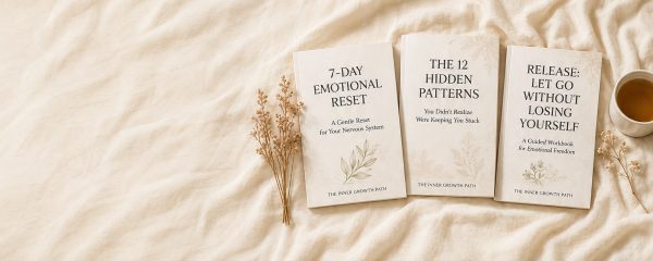 Three guided healing workbooks from The Inner Growth Path displayed on warm cream fabric